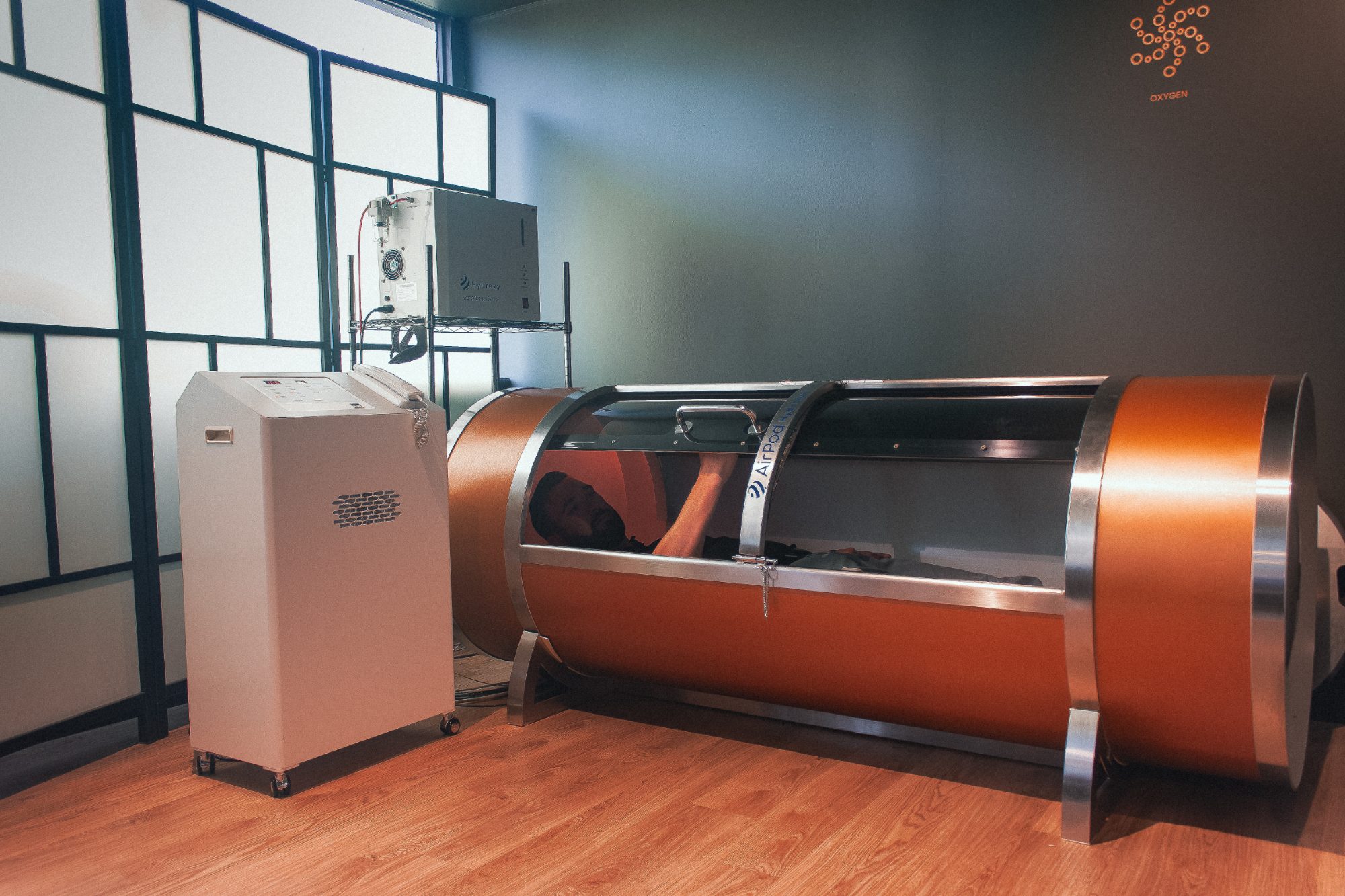 A client inside the AirPod hyperbaric chamber at Mindbody Lounge, Victoria Park