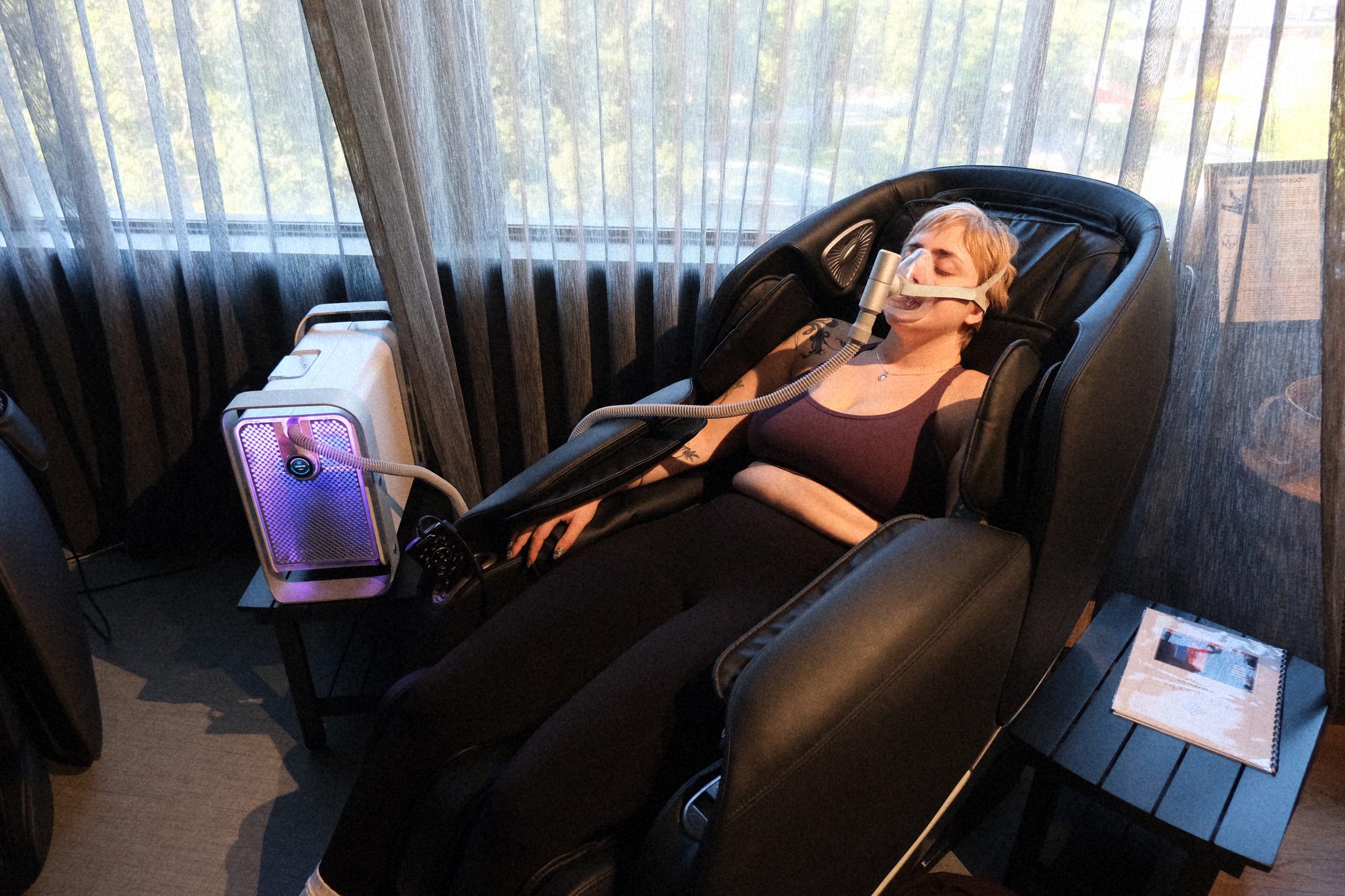 Hydrogen inhalation therapy with the Healr hydrogen mask in the zero-gravity massage chair at Mindbody Lounge, Victoria Park